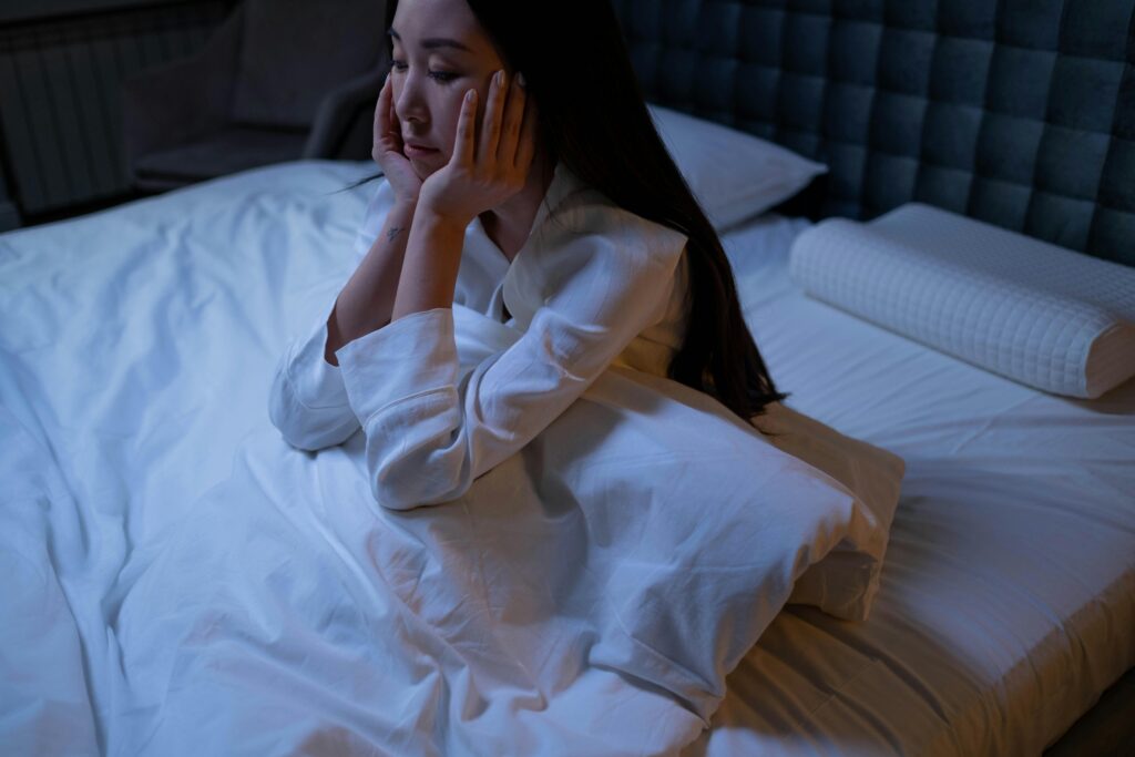 Woman struggling with insomnia at night